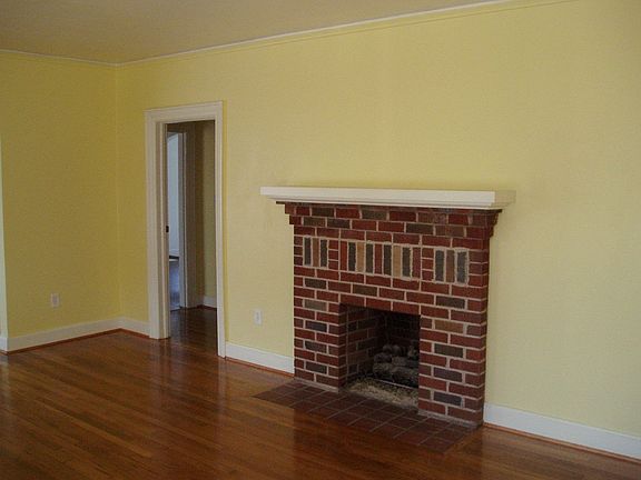Formal Living With Gas Log Fireplace adjacent to Formal Dining