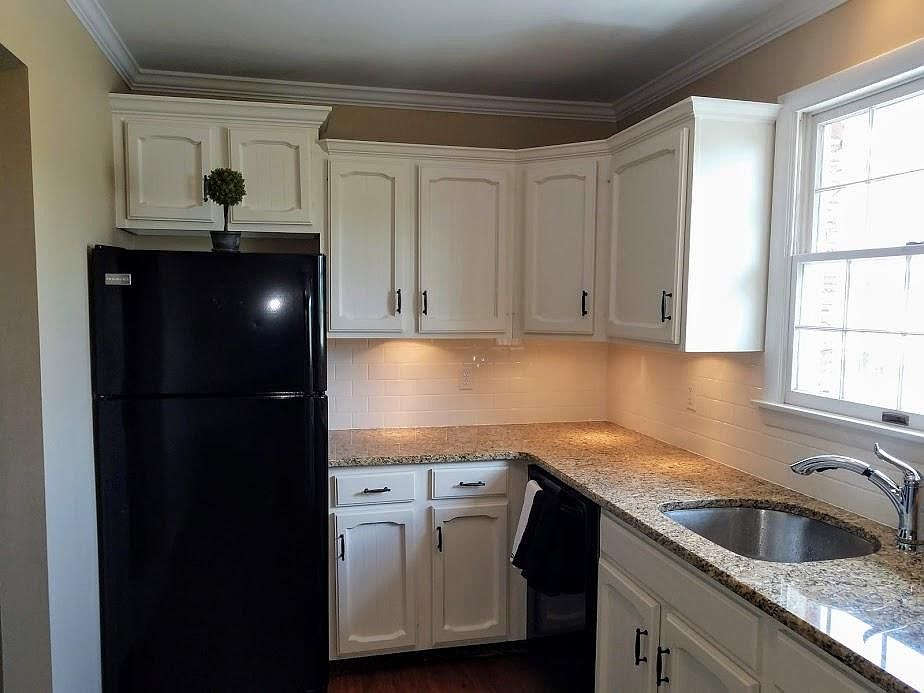 Remodeled Kitchen with granite countertops. Includes Refrig., Dishwasher, Range, Microwave, and garbage disposal.