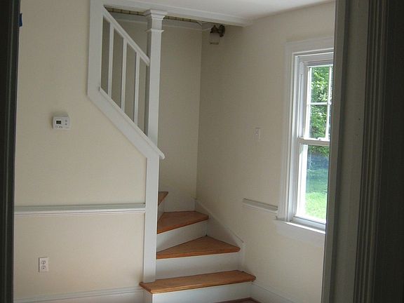View from kitchen, thru dining room to staircase.