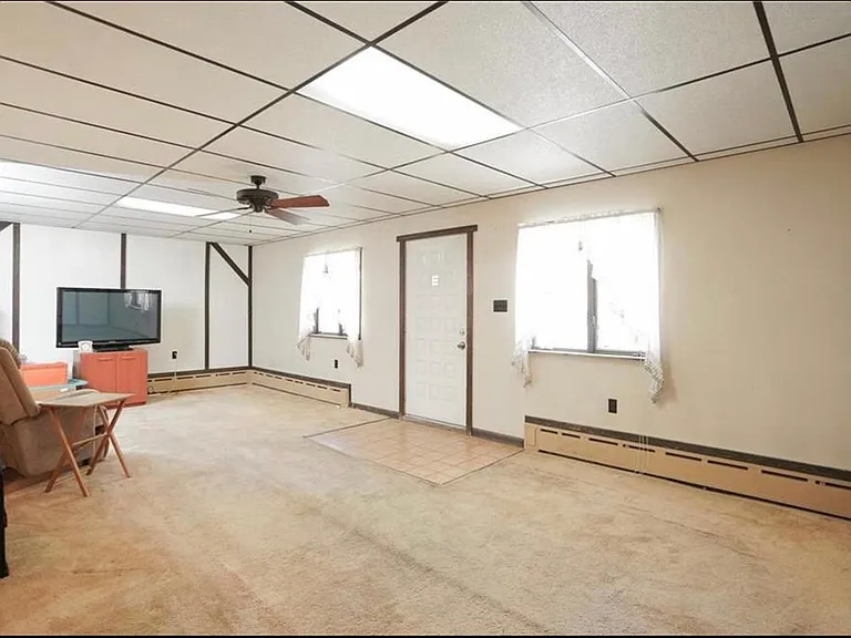 The living room is not only huge, it is bright, and has built-in storage