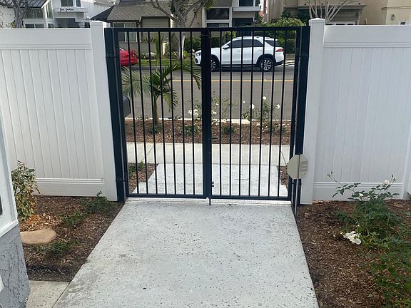 Gated courtyard entry.