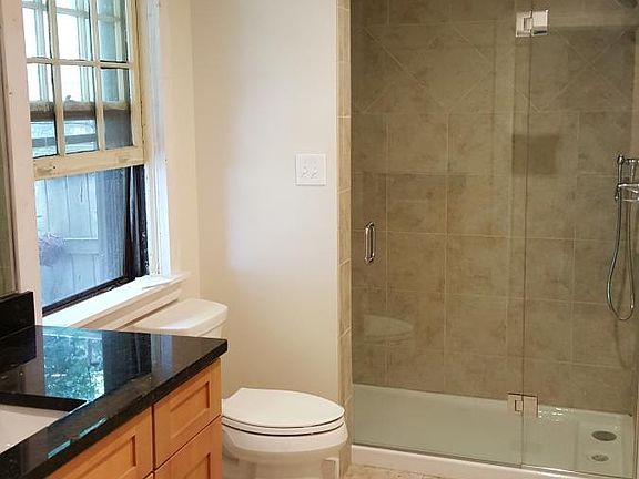 Oversized custom tile shower with glass door