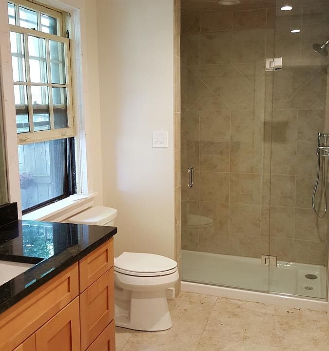 Oversized custom tile shower with glass door