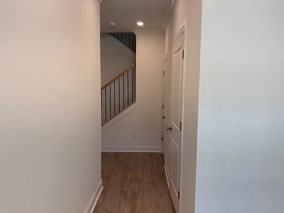 Upon entering the home, there is a powder room and coat closet