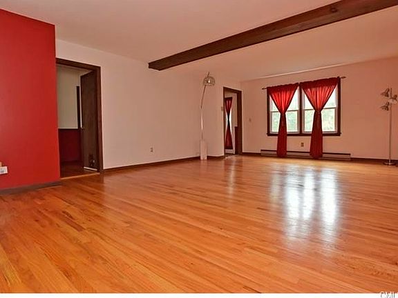 Living Room truly sprawling.  Note gleaming hardwood floors, which are thruout practically the entire of this spacious 4 Bedroom abode.