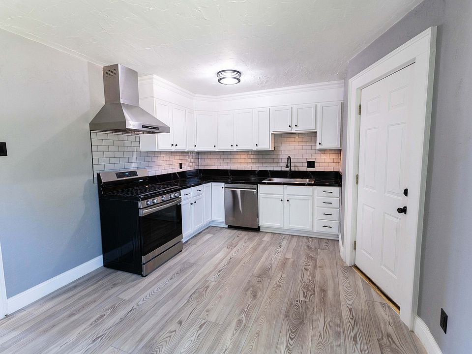 Fully renovated kitchen with smart range, motion activated range hood, stainless appliances, and under-cabinet lighting