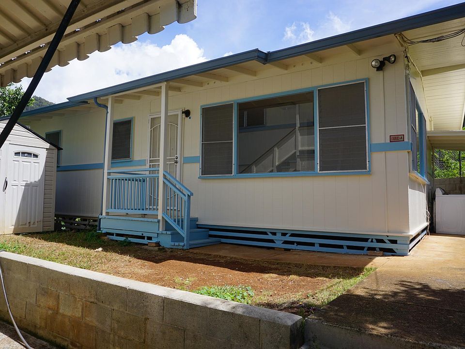 Front view of house with storage shed