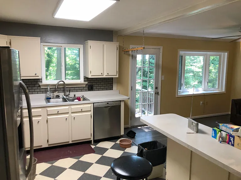 Kitchen from the door to the diningroom and looking to door to backyard