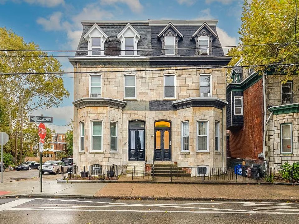 Front of house, unit is the top 4 windows on the right side of the twin
