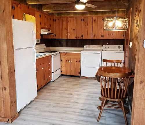 Kitchen includes refrigerator, stove, washer and dryer.