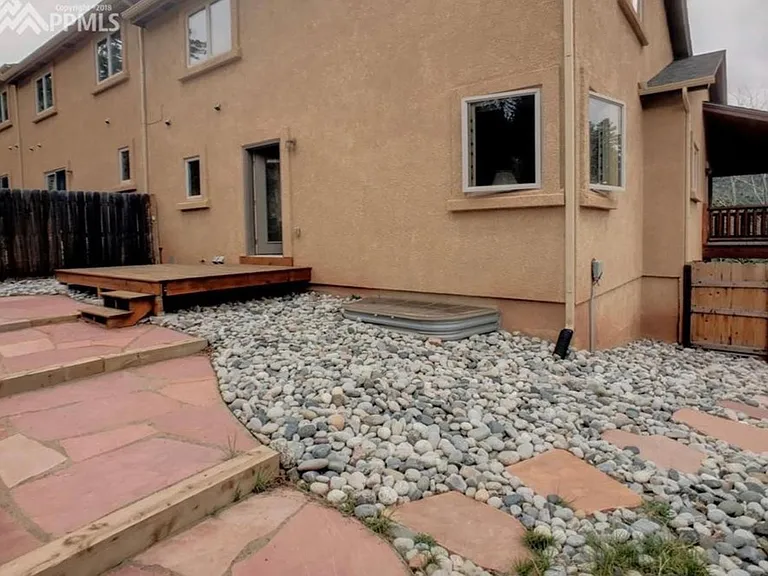 Fenced/gated back yard with Deck and Patio