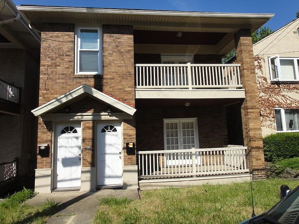 Beautiful brick Home, each apartment with their own ample cover porch, great location close to everything, available now or 12/01/22.