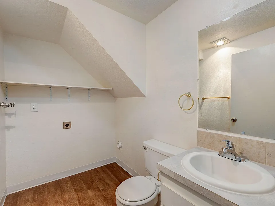 Downstairs half bathroom with washer and dryer hookups