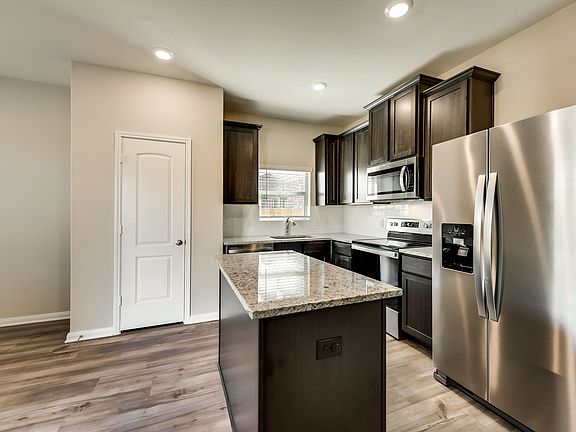 The kitchen is open to the dining room and living room.