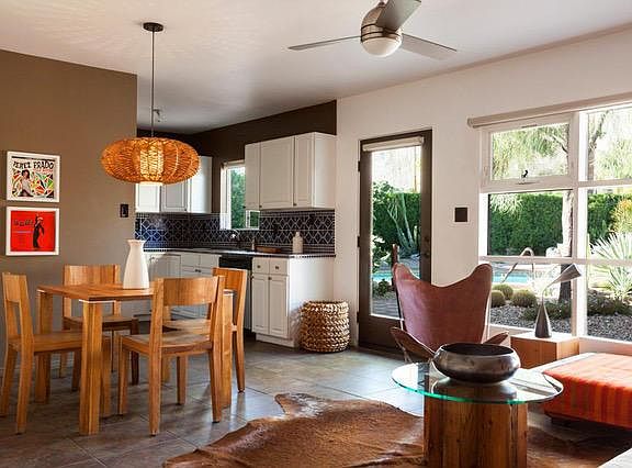 View of living area and kitchen toward pool.