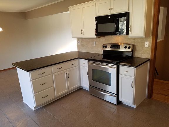 granite countertops, tile floor