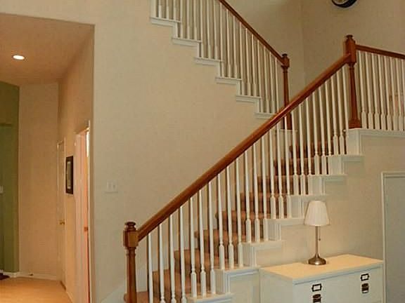 This entry is a show stopper!  Beautiful staircase and high windows greet your guests.