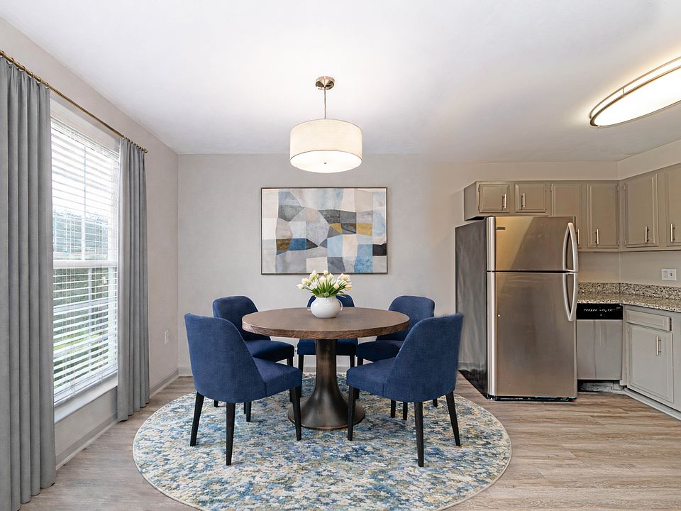 Dining area with hardwood-style flooring