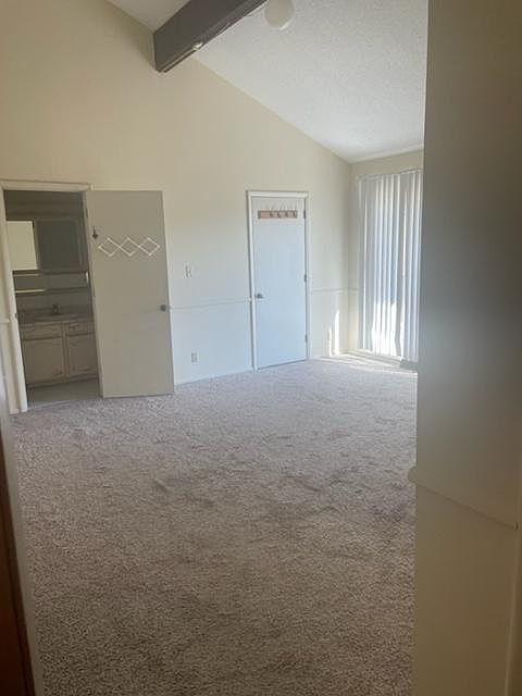 Large master bedroom with vaulted ceilings, deck, 2 walkin closets and 3/4 bath.