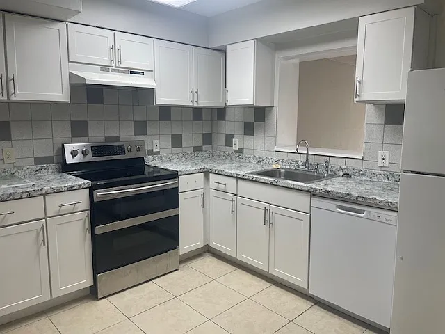 Kitchen overlooks into large Family room