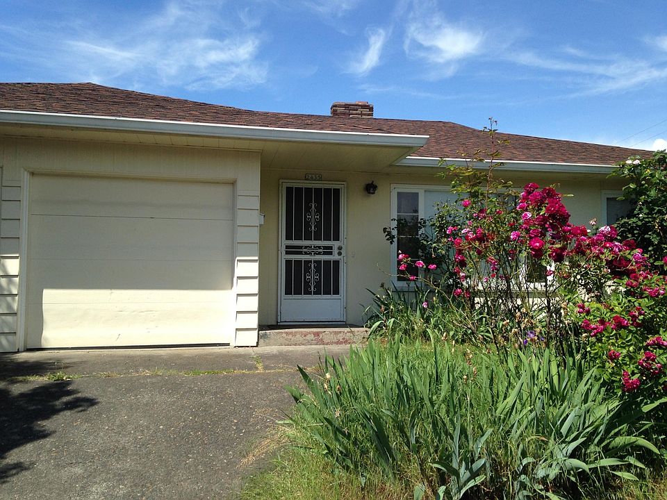 Front Door - duplex with garage; large window in L/R.