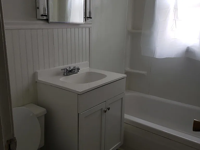 Bathroom toilet, sink and bathtub.