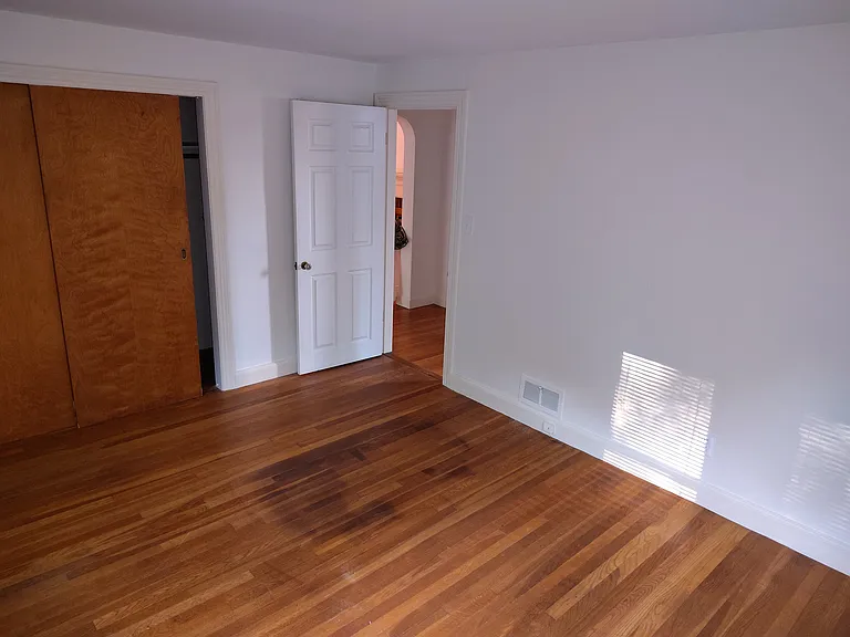 Master bedroom showing closet and door.