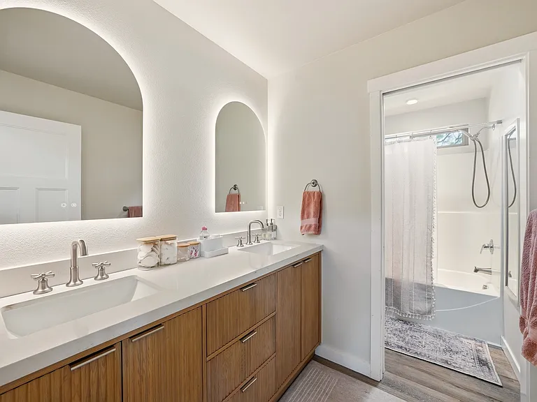 Brand new custom bathroom! The mirrors are touch lights with anti-fog. Lovely soft-close drawers have plenty of storage. The toilet/shower area has a slider door for privacy.