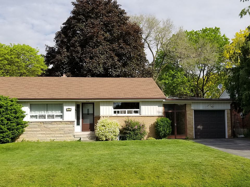 Fully detached bungalow with detached single car garage in a established neighborhood.