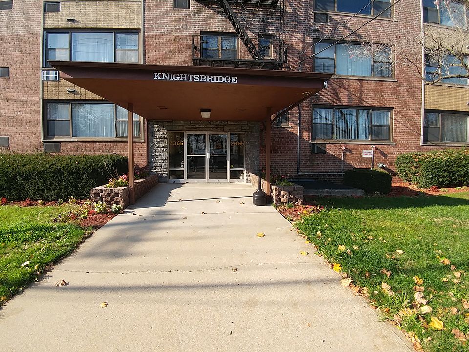 Front of building window to the right of entrance is in this