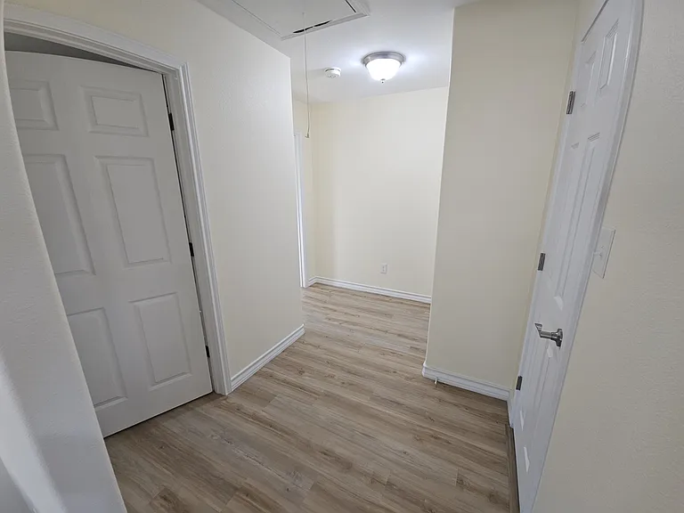 Hallway to 2 bedrooms with 2nd bathroom & hall closet