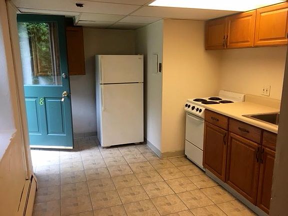 Kitchen is inside the front door 