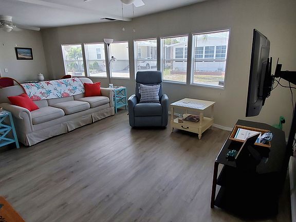 TV swivels for easy viewing from multiple areas and bank of 6 front windows allows ample natural light