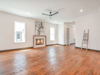 living area with natural light and a cozy fireplace perfect for fall and winters