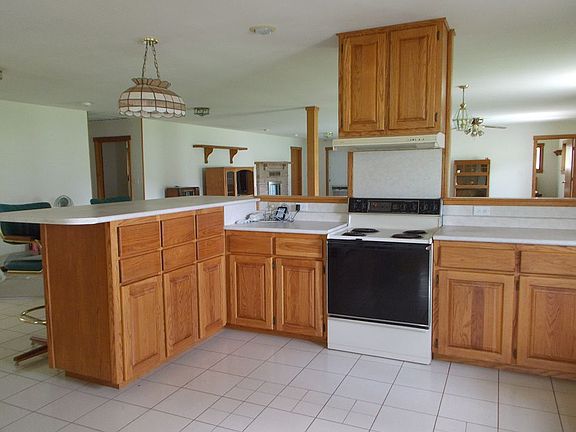 Kitchen has oak cabinets.