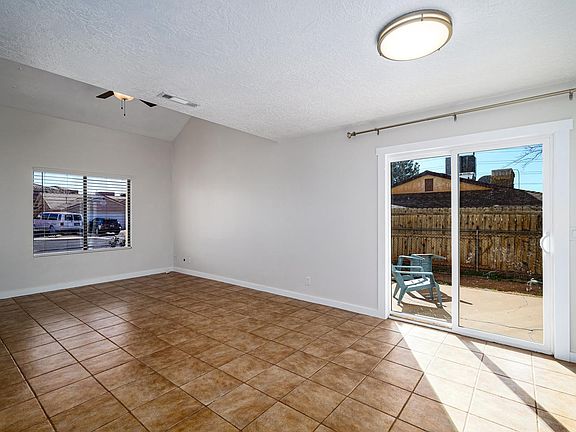 Living and dinning room with sliding door to south facing patio