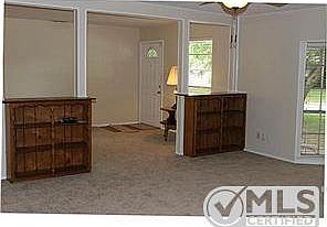 View of entry way with storage book shelves dividers