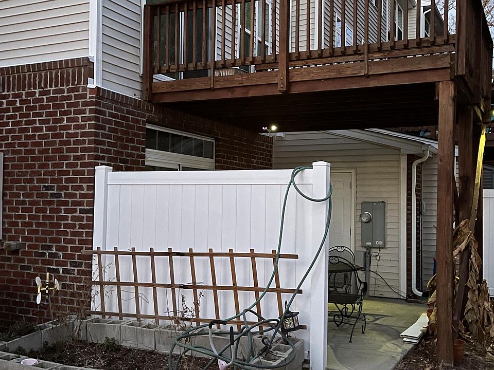 Deck with patio space below and garden bed on the side