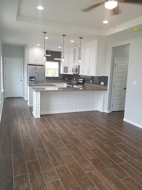 Full size kitchen with plenty of storage and island center. 