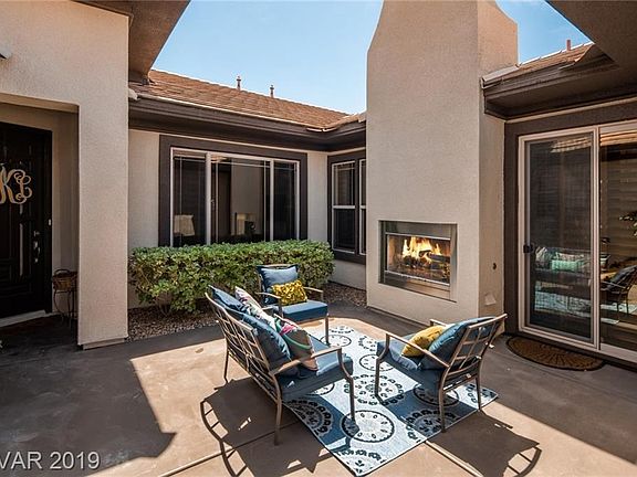 This home was truly built for entertaining, beginning with the oversized courtyard with fireplace