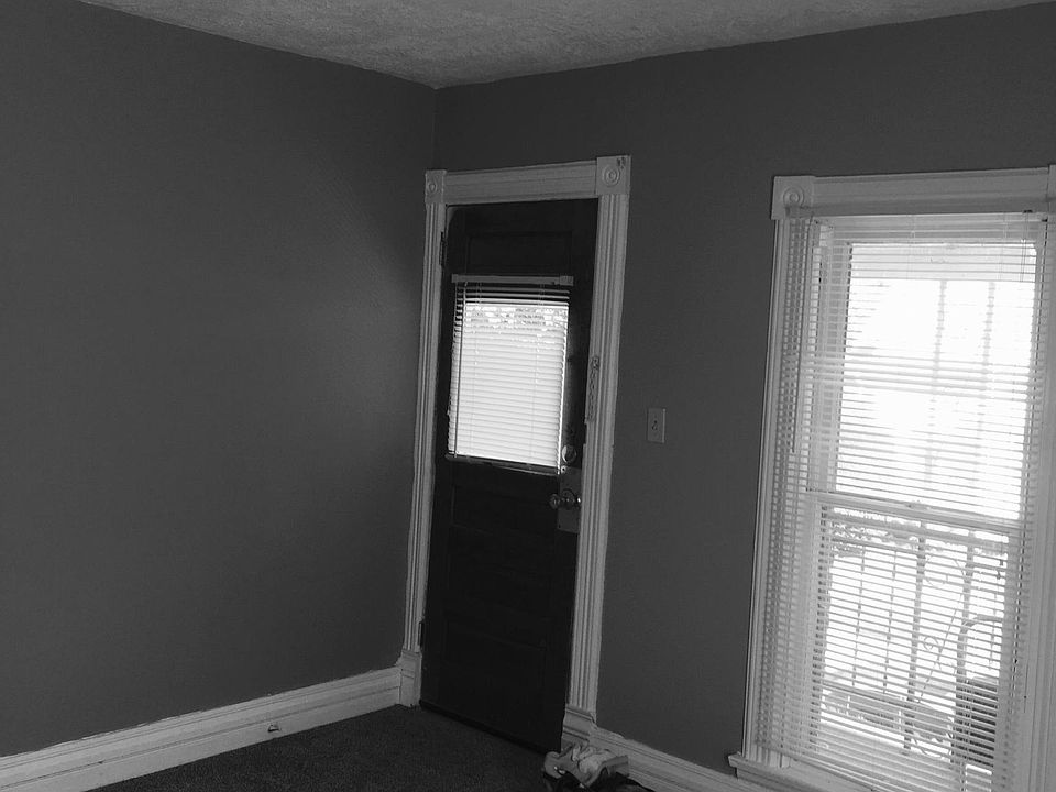 Side door off new deck and stairs up to second floor. Front entrance is enclosed stairway to second floor.