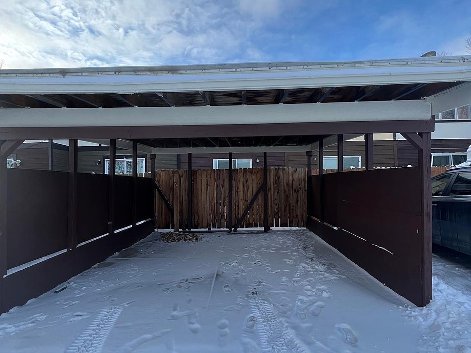 Covered carport in back of house
