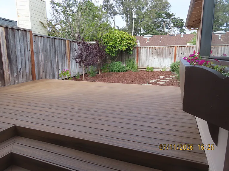 Rear yard area and deck from garage