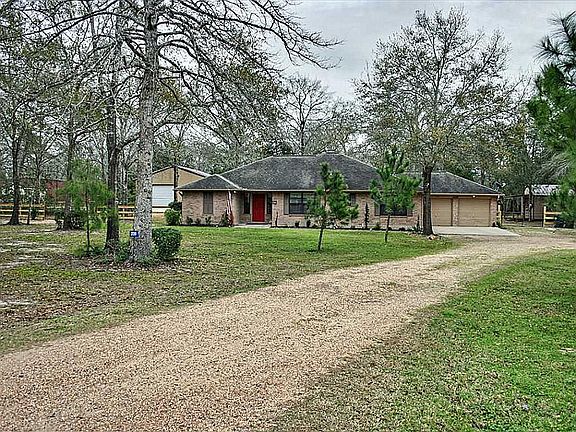 House blends nicely in the wooded lot.