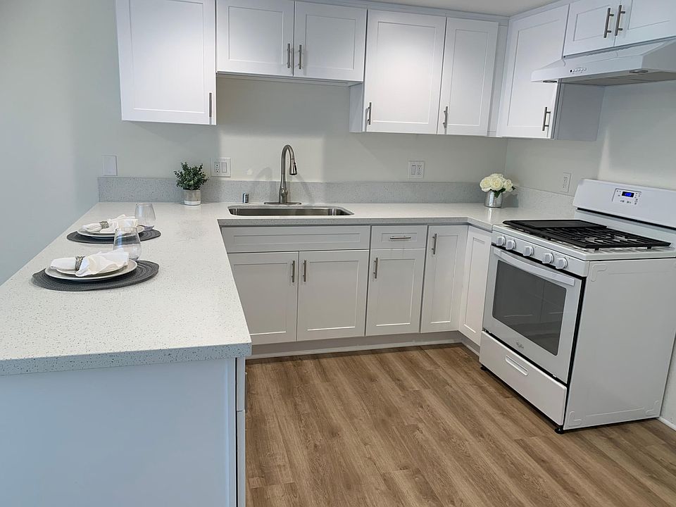 Remodeled kitchen with new cabinets, counters, appliances and flooring