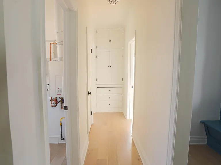 Hallway with laundry room to the left