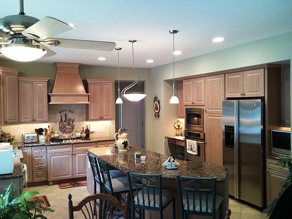 Kitchen - Granite Tops, Island, 5 Burner Gas Stove with Hood, Stainless Apps.