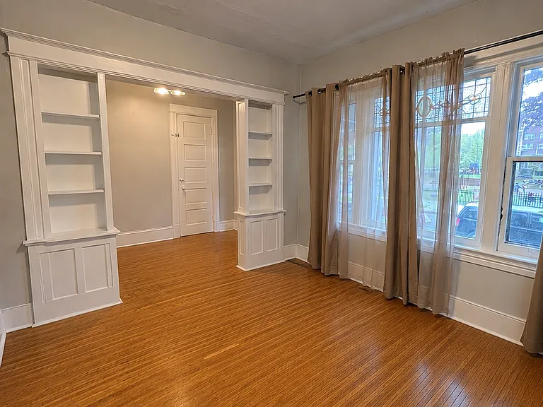 Living room facing back toward entryway. The closed door you see is to the basement.