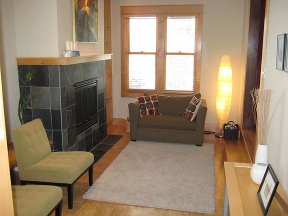 gas fireplace with slate surround and cork floors