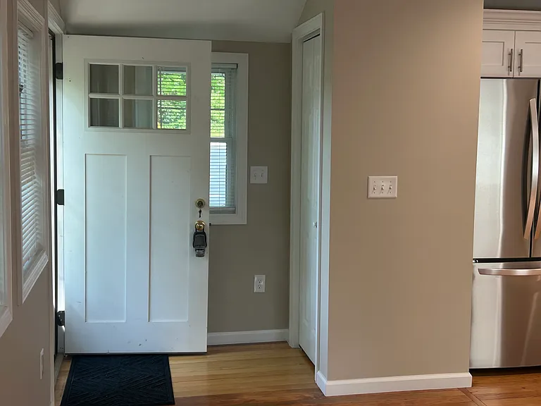 Walk into open floorplan with kitchen & living area